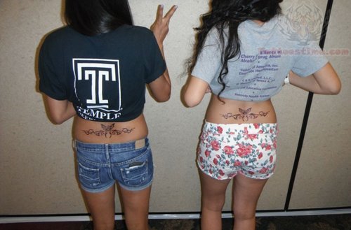 Butterfly And Tribal Tattoos On Girls Lower Back